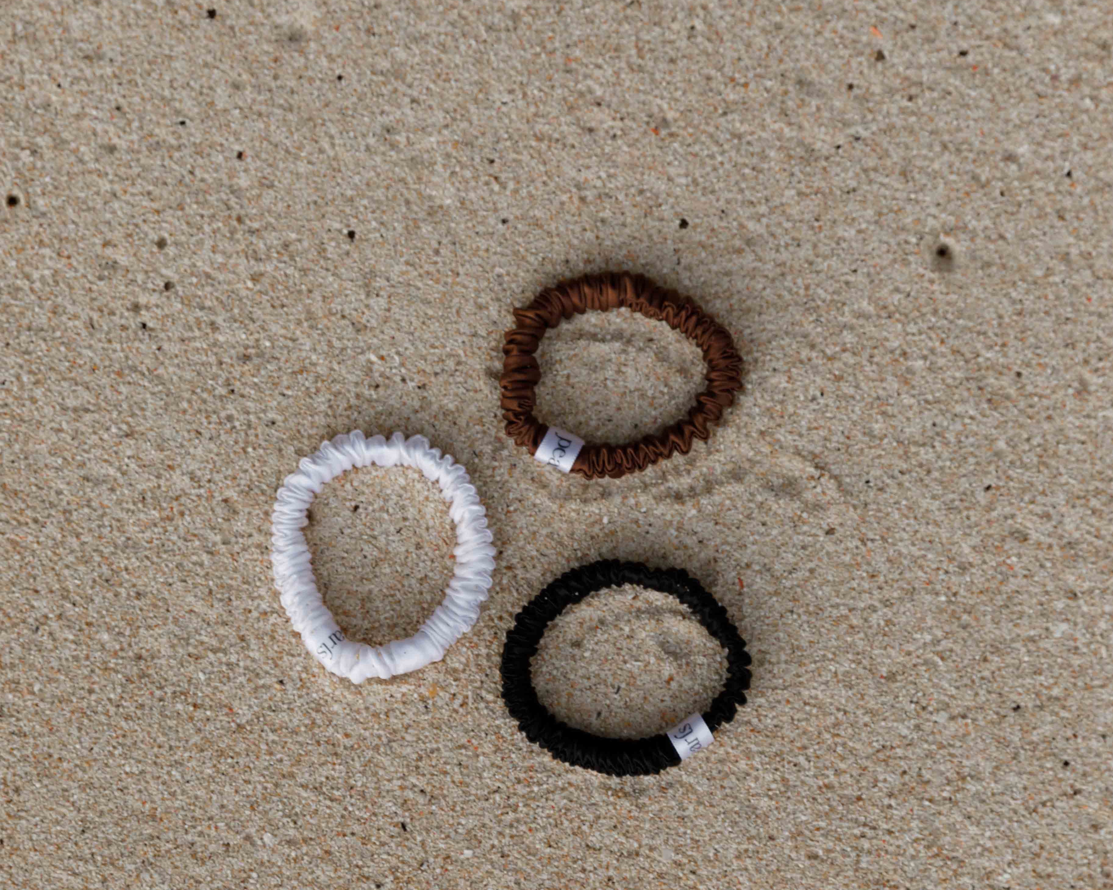 Silk scrunchies by Pearls Studios on the sand