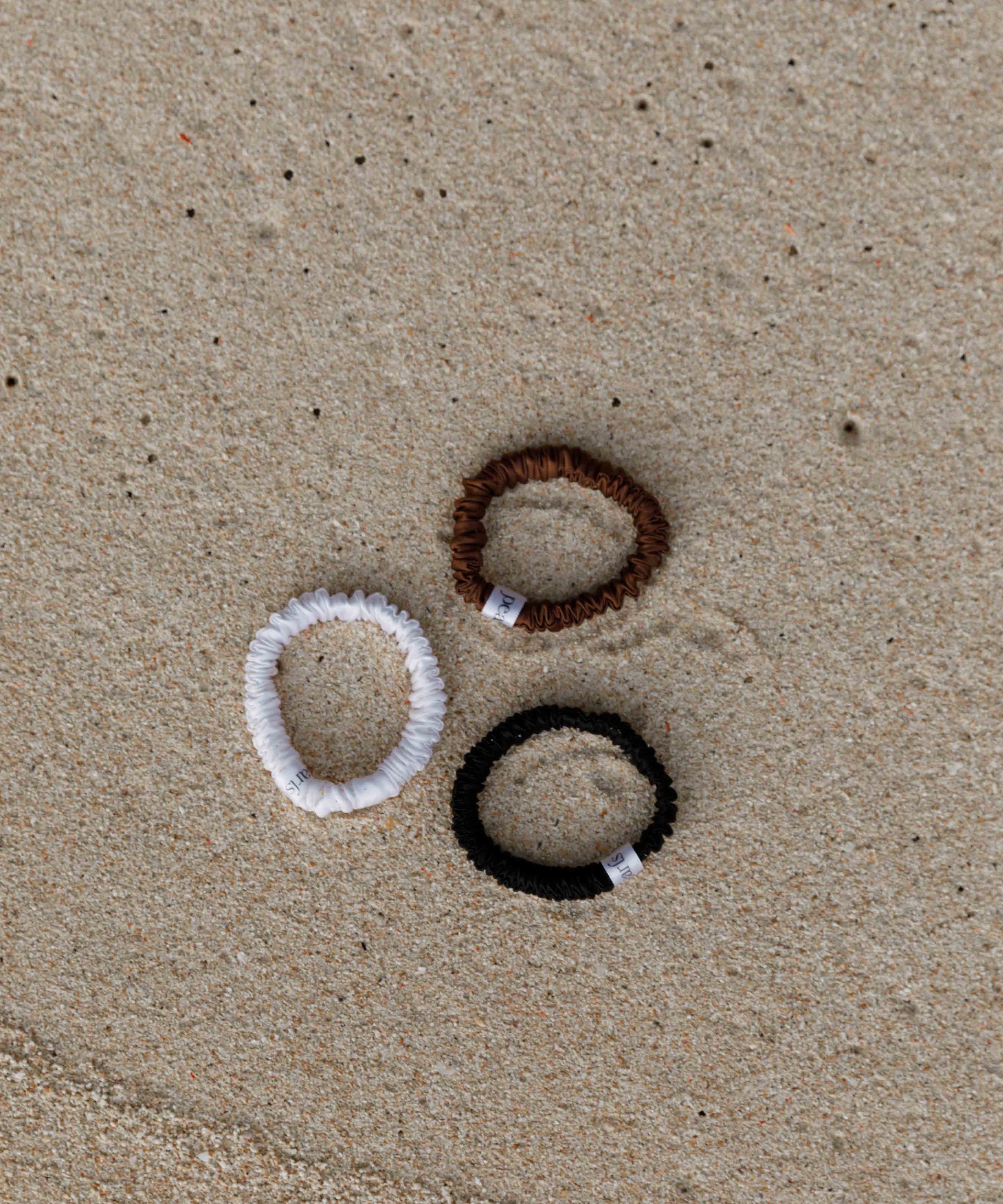 Silk scrunchies by Pearls Studios on the sand